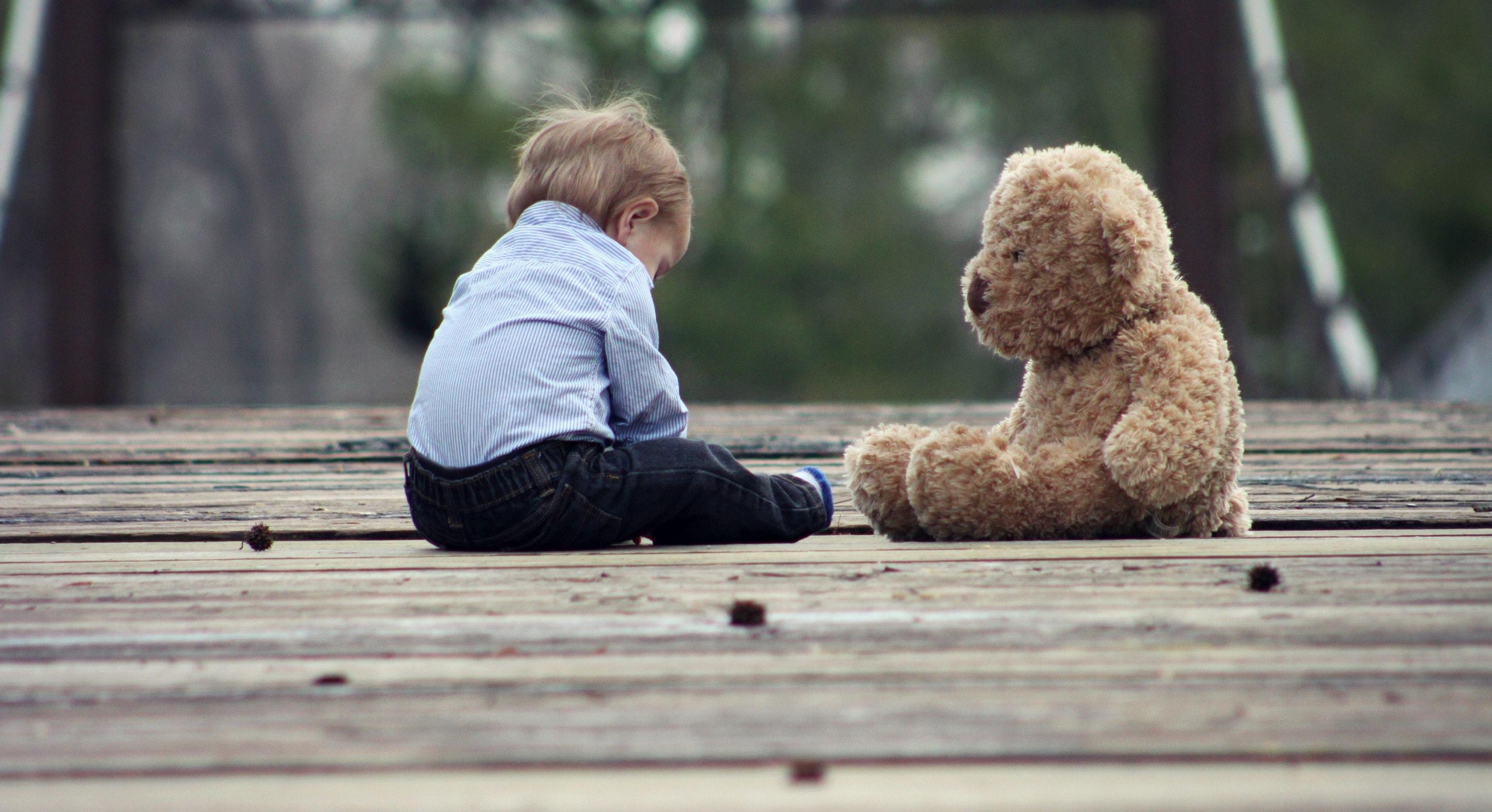 Toddler with teddy bear