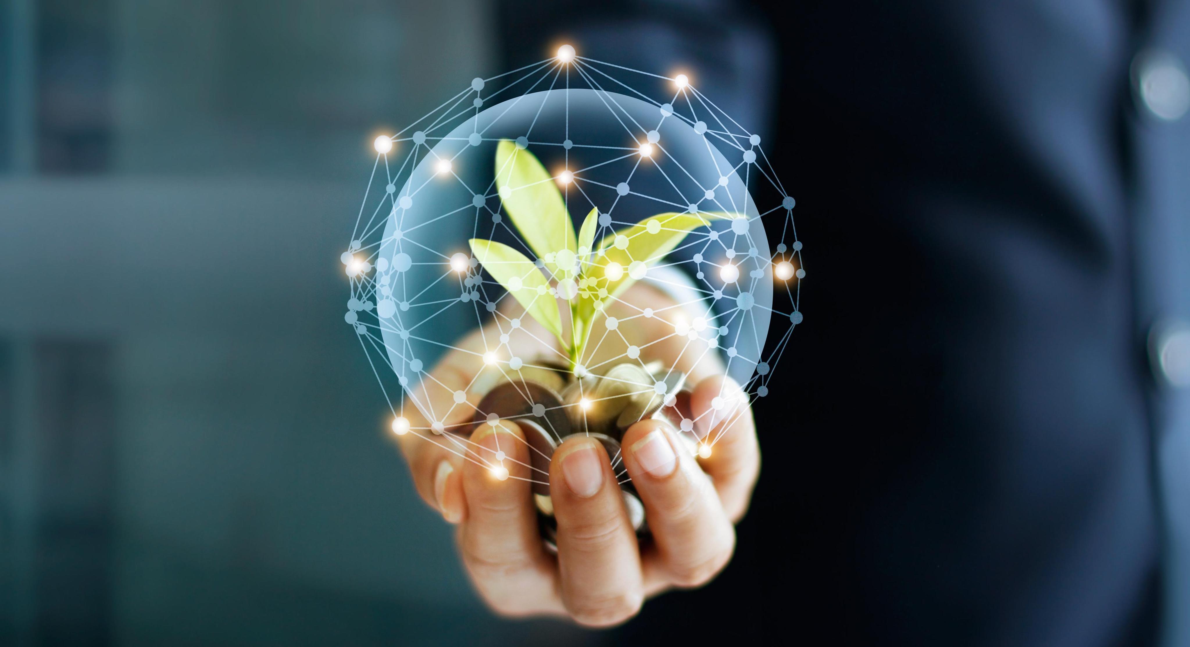 Hand with plant and globe